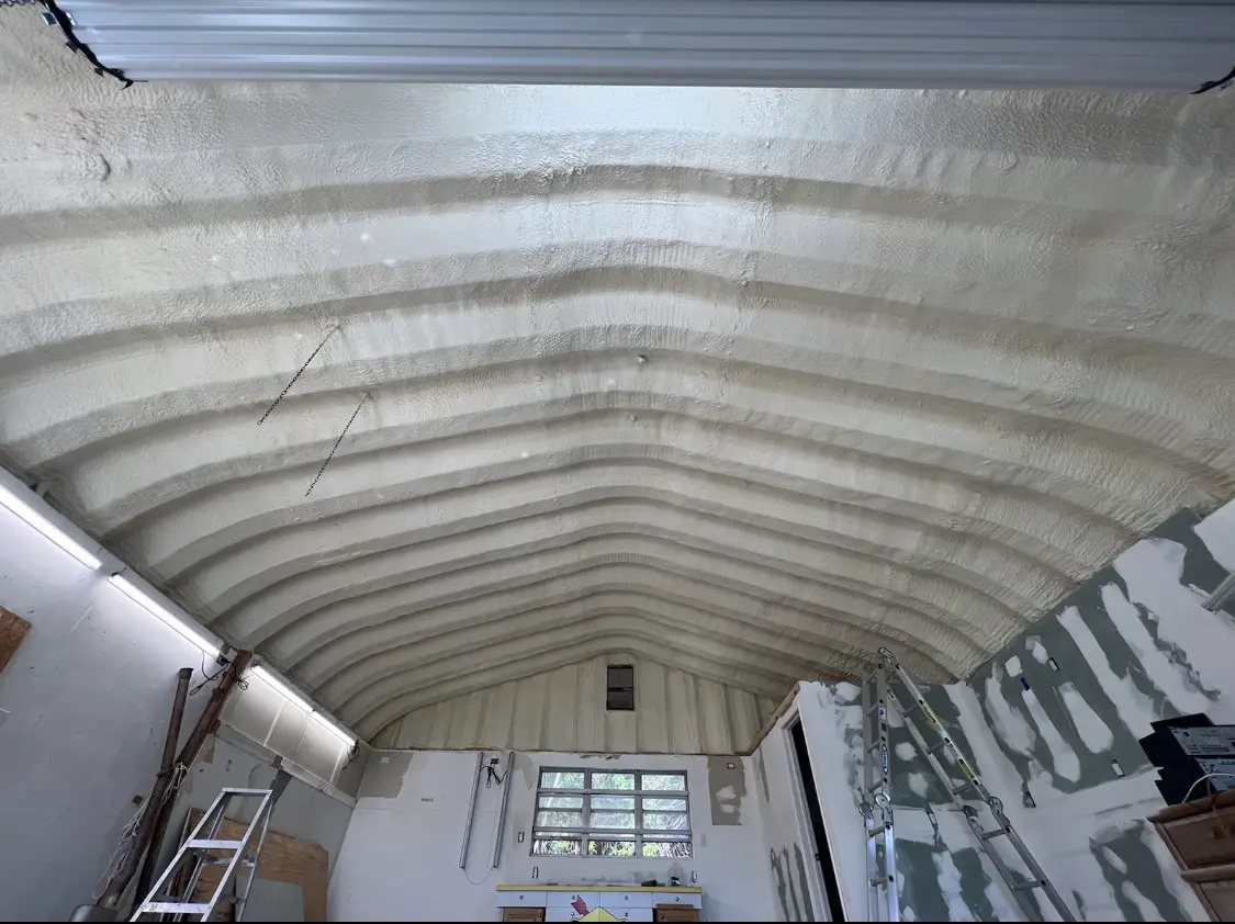 Spray polyurethane foam applied to the underside of a metal roof deck in Portland